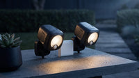 Black Smart Lighting Motion Activated Outdoor Integrated LED Spot Light Battery 2-Pack with Smart Lighting Bridge White — Lifestyle